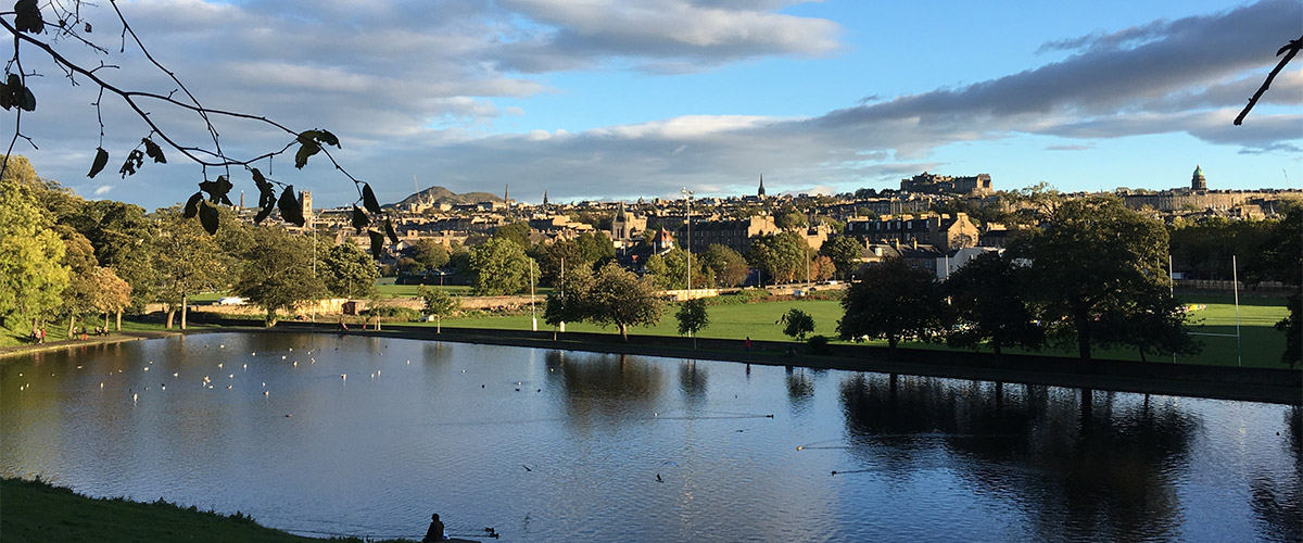 Inverleith Pond, Stockbridge and Edinburgh city centre skyline seen from Inverleith Park