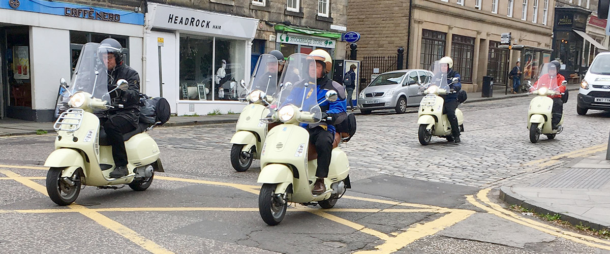 Formation scooter riders in Baxters Place, Stockbridge